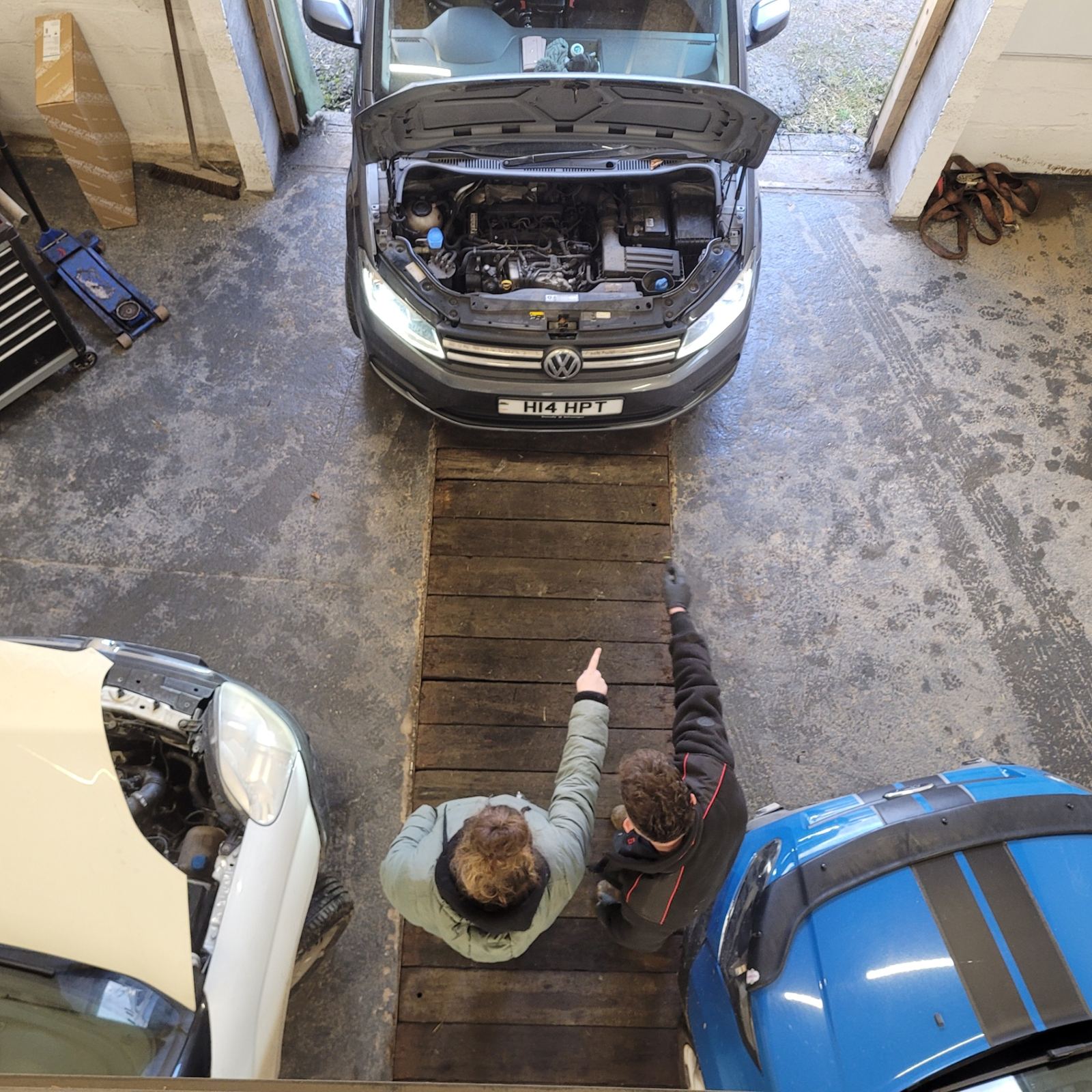 Talking a customer through their van in the Pencader workshop