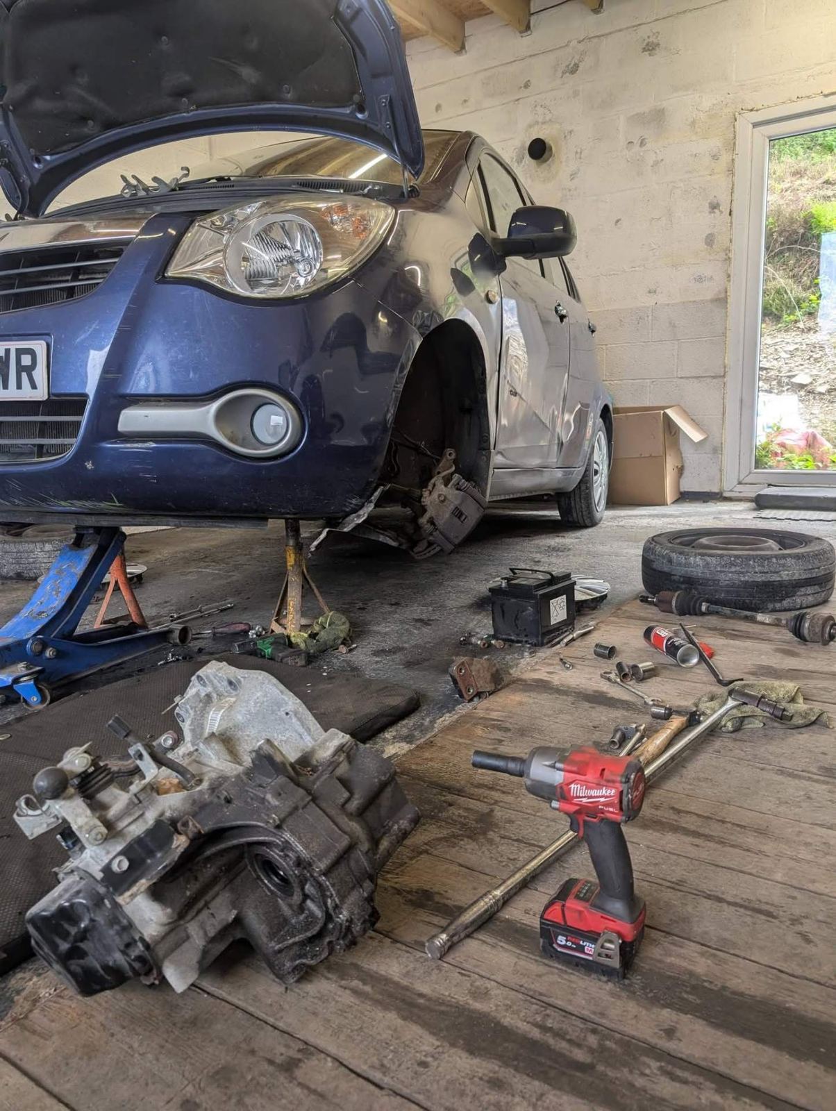 Gearbox removed from a car during a clutch replacement