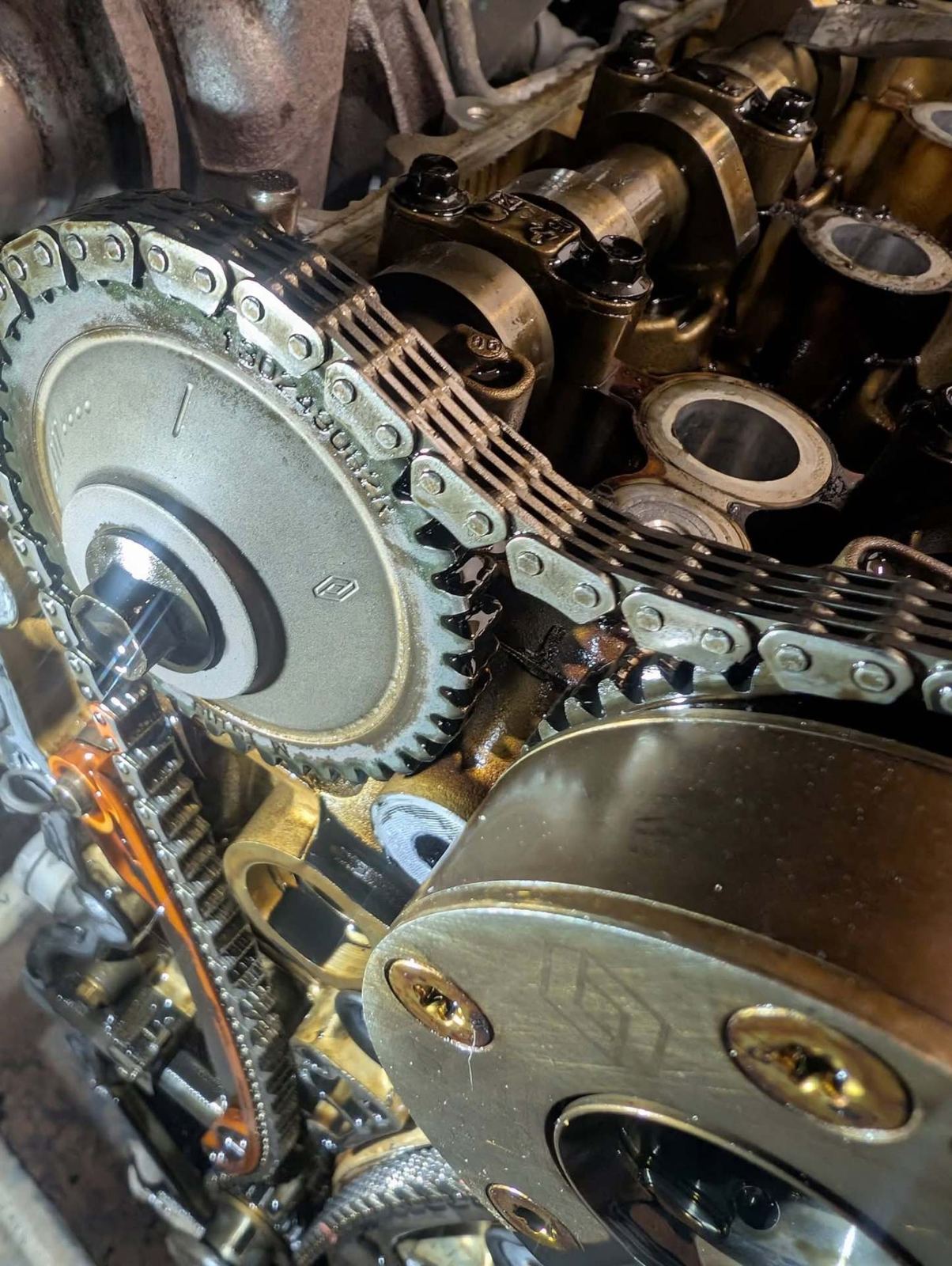 Close-up of a timing chain and camshaft gears
